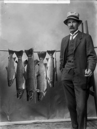 Mr Clark with trout. Ref: 1/1-005184-G. Alexander Turnbull Library, Wellington.