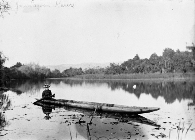Woman paddling in dugout canoe in Jone's Lagoon, Karere, c1905. Palmerston North City Library, 2007N_Lo27_BRW_0609